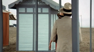 guy tries to block shooter with glass door gif